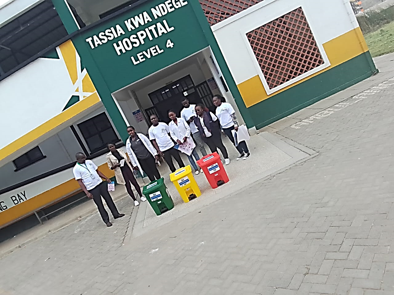 Team with waste bins at Tassia Kwa Ndege Hospital, Nairobi