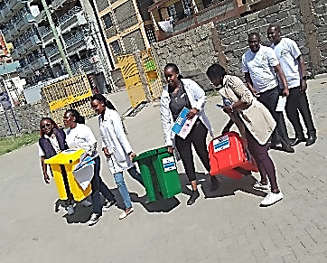 Team delivering waste bins on the street in Nairobi