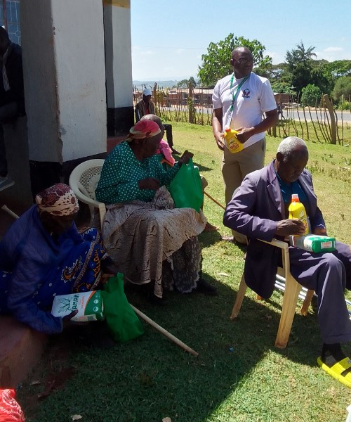 TAIDe volunteer with an elderly resident in West Pokot