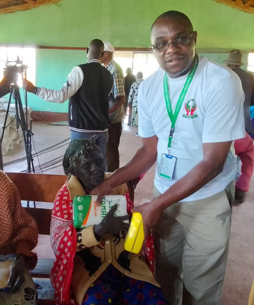 TAIDe team member handing food supplies to a resident in West Pokot